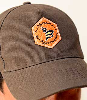 brown caps logo embroidery shops companies in dubai uae